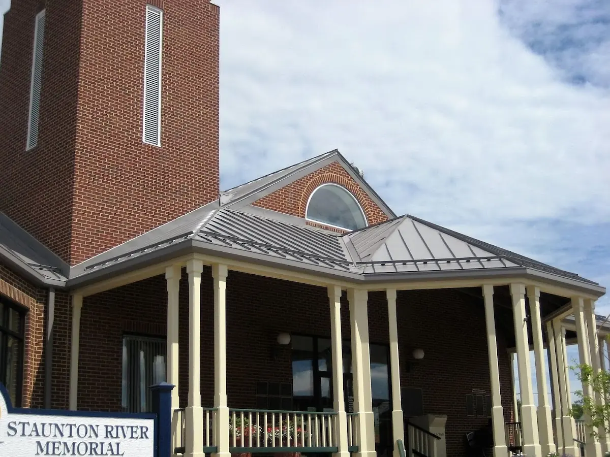 Skilled roofing craftsmen working on a residential roof in Pottersville